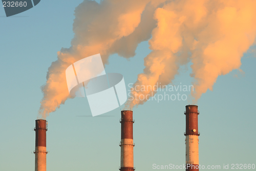 Image of Three smoking chimneys