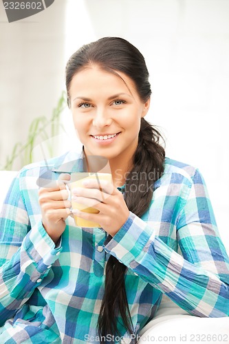 Image of lovely housewife with mug