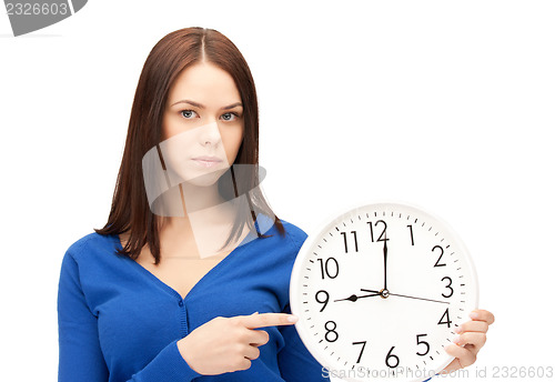 Image of woman holding big clock