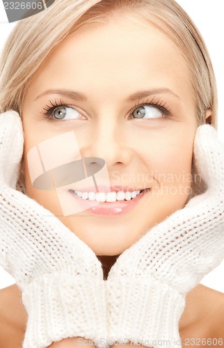 Image of beautiful woman in mittens