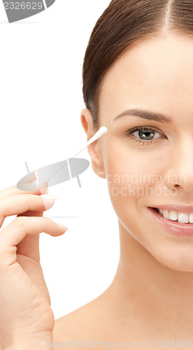 Image of beautiful woman with cotton bud