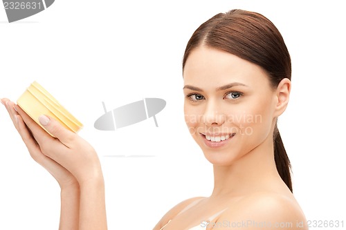 Image of beautiful woman with moisturizing creme