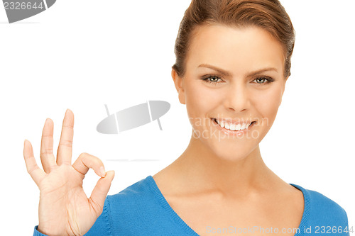 Image of lovely teenage girl showing ok sign