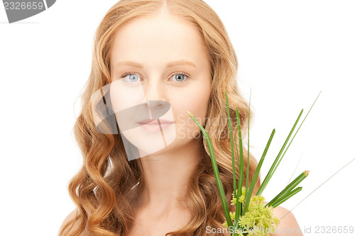 Image of woman with green sprout