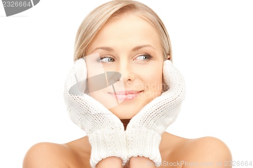 Image of beautiful woman in mittens