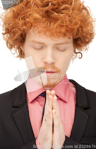 Image of praying businessman