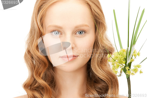 Image of woman with green sprout