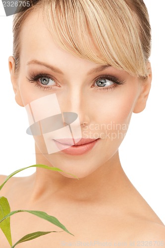 Image of woman with green sprout
