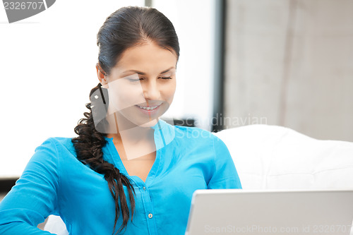 Image of happy woman with laptop computer