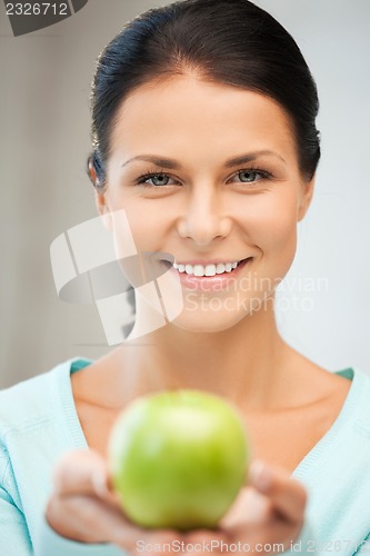 Image of lovely housewife with green apple