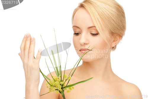 Image of woman with green sprout