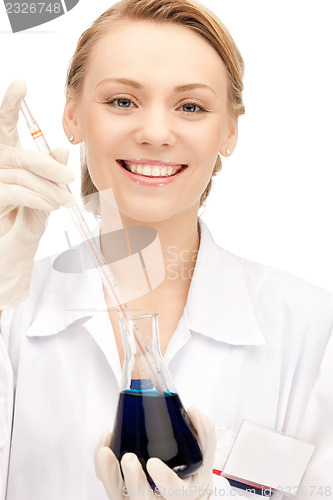 Image of lab worker holding up test tube