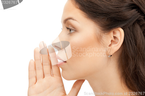 Image of woman whispering gossip