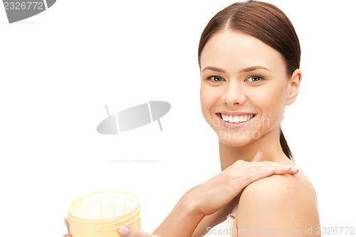 Image of beautiful woman with moisturizing creme