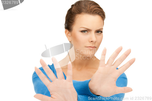 Image of woman making stop gesture