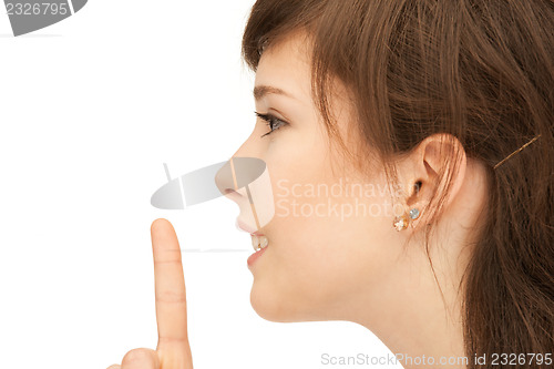 Image of finger on lips