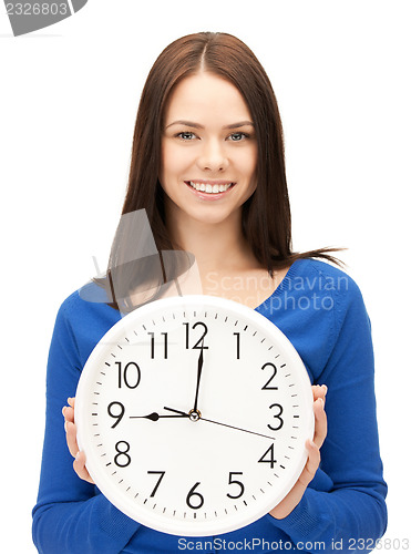 Image of woman holding big clock