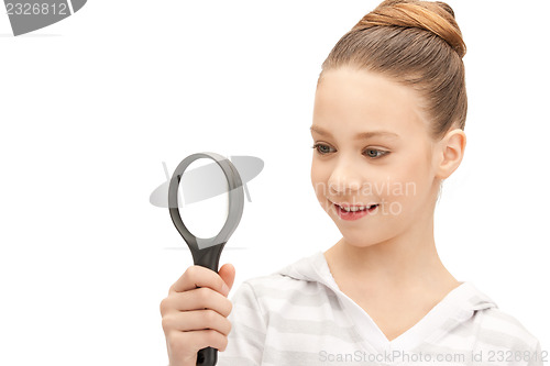 Image of teenage girl with magnifying glass