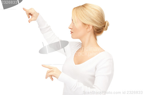 Image of businesswoman working with something imaginary