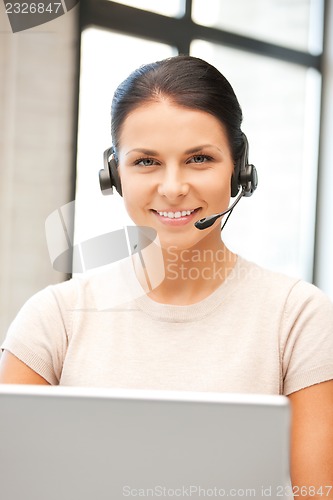 Image of helpline operator with laptop computer