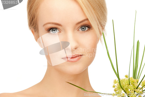 Image of woman with green sprout