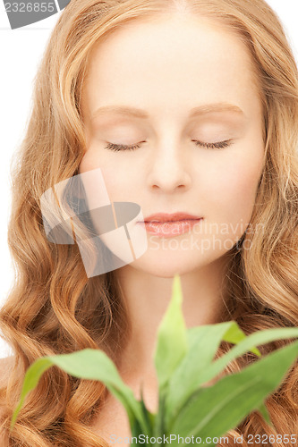 Image of woman with green sprout