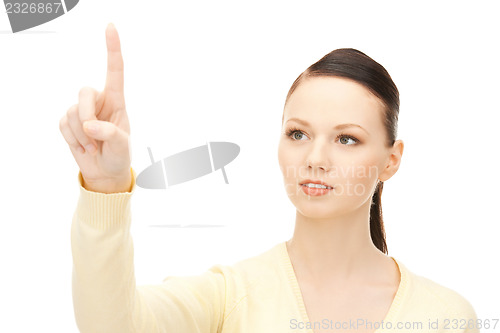 Image of businesswoman working with something imaginary