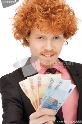 Image of handsome man with euro cash money