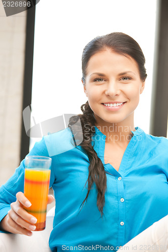 Image of beautiful woman with glass of juice