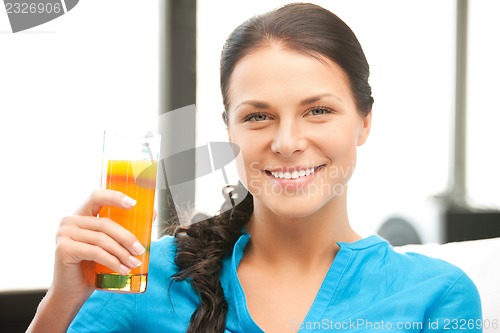 Image of beautiful woman with glass of juice