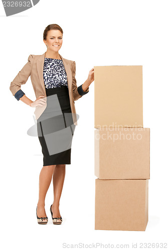 Image of attractive businesswoman with big boxes