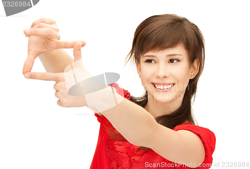Image of teenage girl creating a frame with fingers