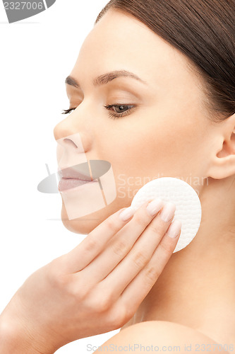 Image of beautiful woman with cotton pad