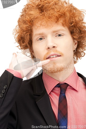 Image of man making a call me gesture