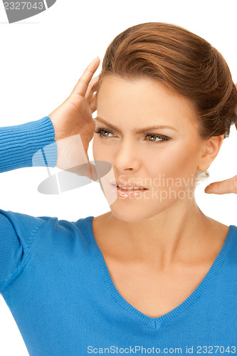 Image of woman with hands on ears
