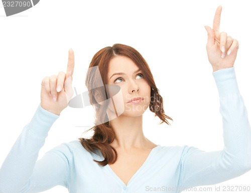 Image of businesswoman working with something imaginary