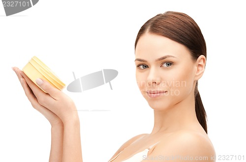 Image of beautiful woman with moisturizing creme
