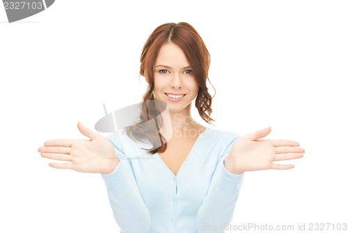 Image of businesswoman working with something imaginary
