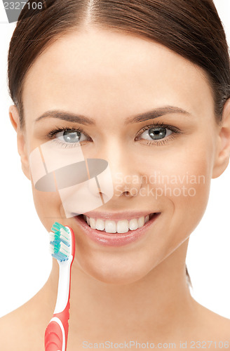 Image of beautiful woman with toothbrush