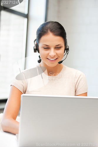 Image of helpline operator with laptop computer