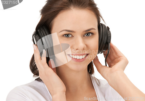 Image of happy teenage girl in big headphones