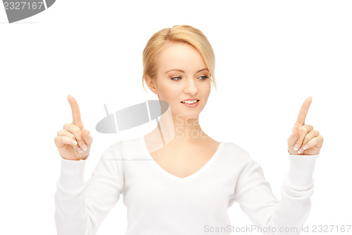 Image of businesswoman working with something imaginary