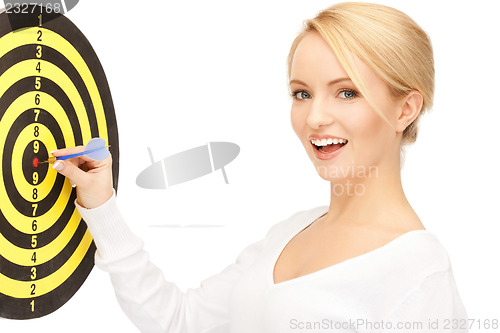 Image of businesswoman with dart and target