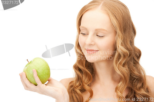 Image of young beautiful woman with green apple