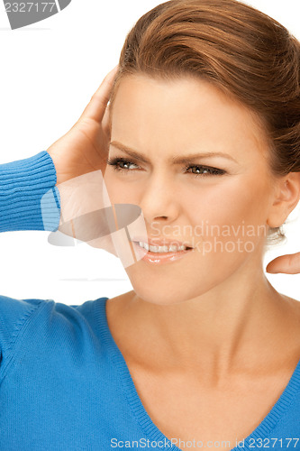 Image of woman with hands on ears