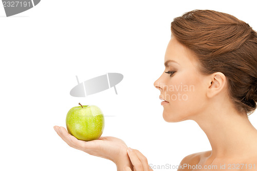 Image of young beautiful woman with green apple