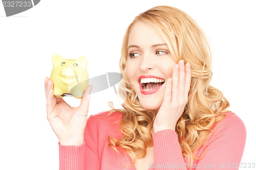 Image of lovely woman with piggy bank