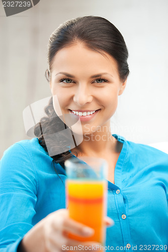 Image of beautiful woman with glass of juice