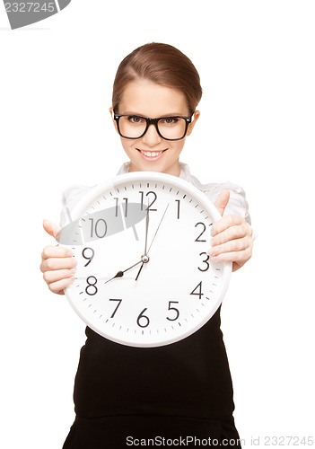 Image of woman holding big clock