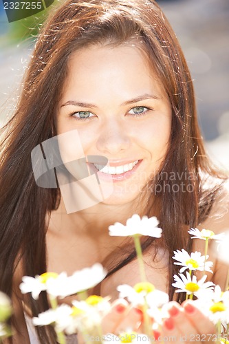 Image of beautiful woman with flowers